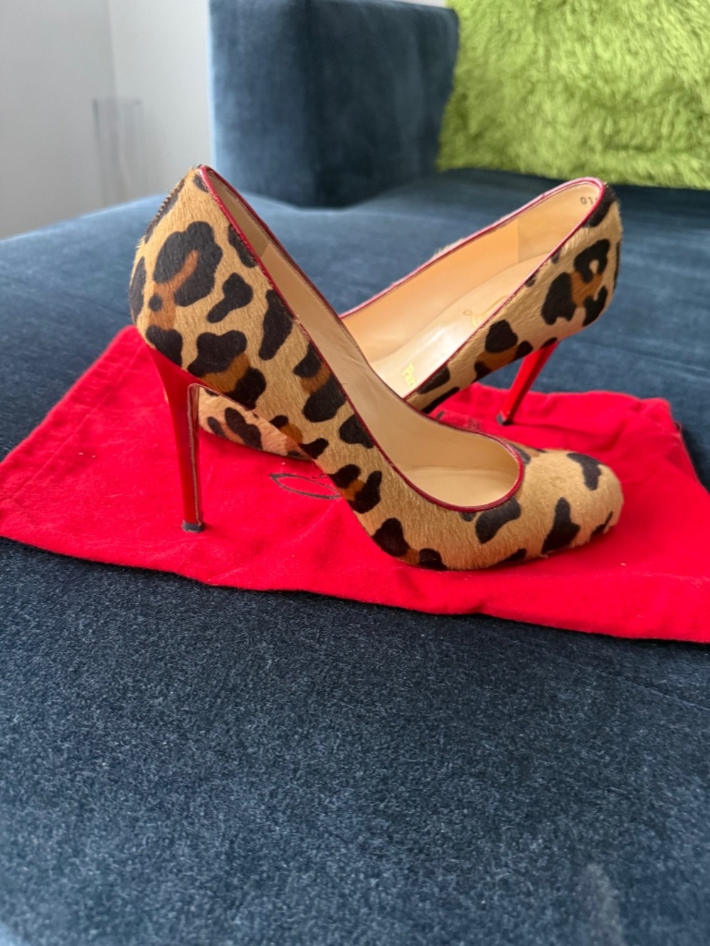 Christian Louboutin hide/ leopard print pumps